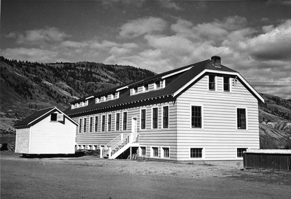 Archival black-and-white photograph of the Kamloops school complex around 1950