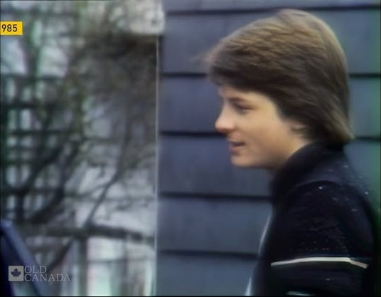 Still from the supplied archival Michael J. Fox Reel, showing him beside a house; open the source on Facebook